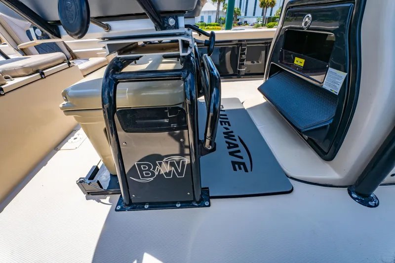 Slide: The Image of 2020 Blue Wave 2400 PureBay boat interior with branded mat and storage area. - 18