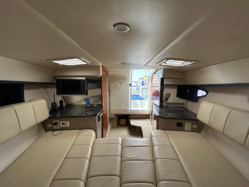 Slide: The Image of Interior of 2007 Formula 330 Sun Sport boat with beige seating and kitchenette. - 14