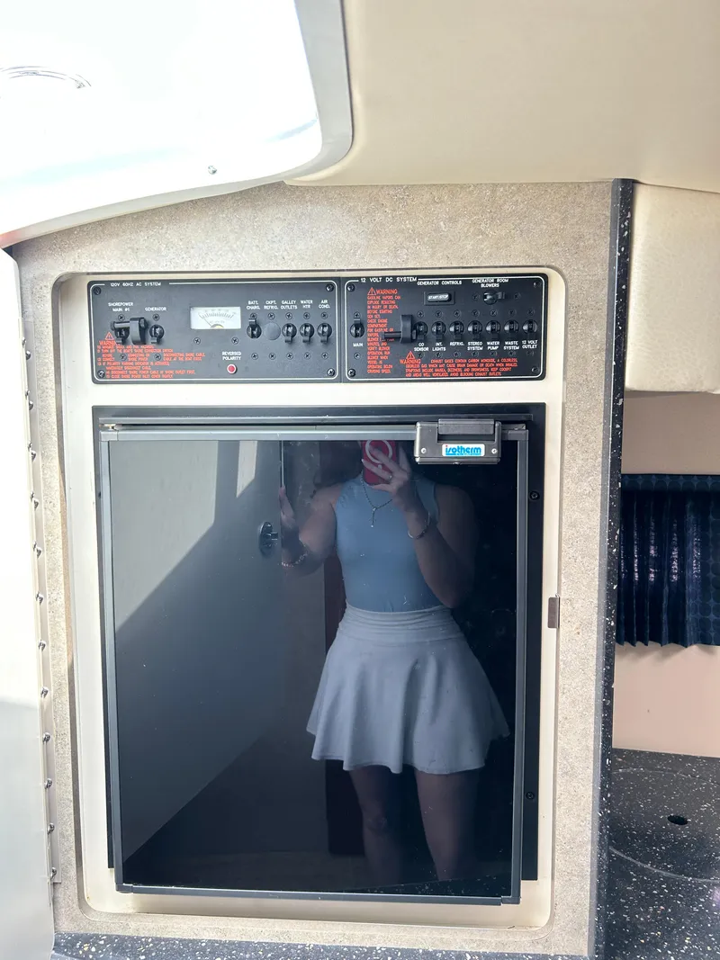 Slide: The Image of Control panel and fridge inside 2007 Formula 330 Sun Sport boat cabin. - 16