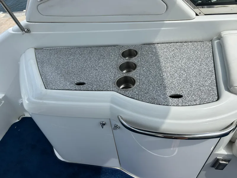 Slide: The Image of 2007 Formula 330 Sun Sport boat interior with granite countertop and cup holders. - 17