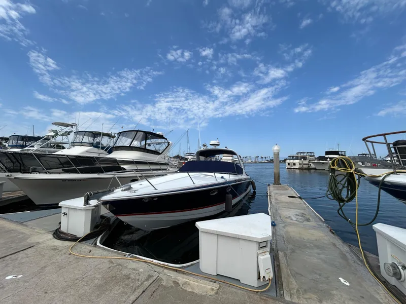 Slide: The Image of 2007 Formula 330 Sun Sport docked at marina under clear blue sky. - 4