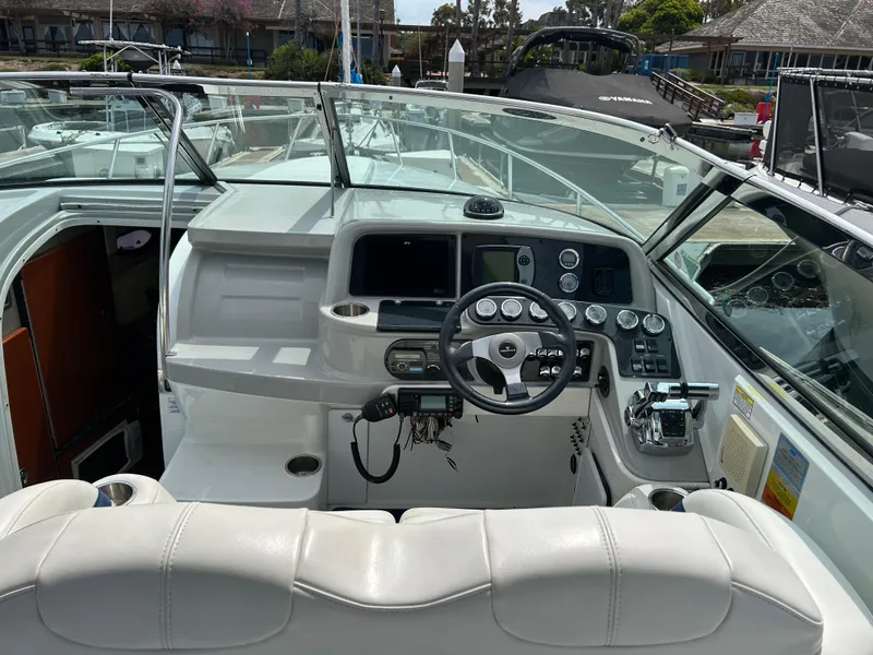 Slide: The Image of 2007 Formula 330 Sun Sport boat cockpit with steering wheel and control panel. - 8