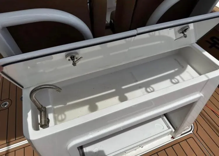 Slide: The Image of 2022 Sea Pro 320 DLX Offshore boat sink and storage area. - 11