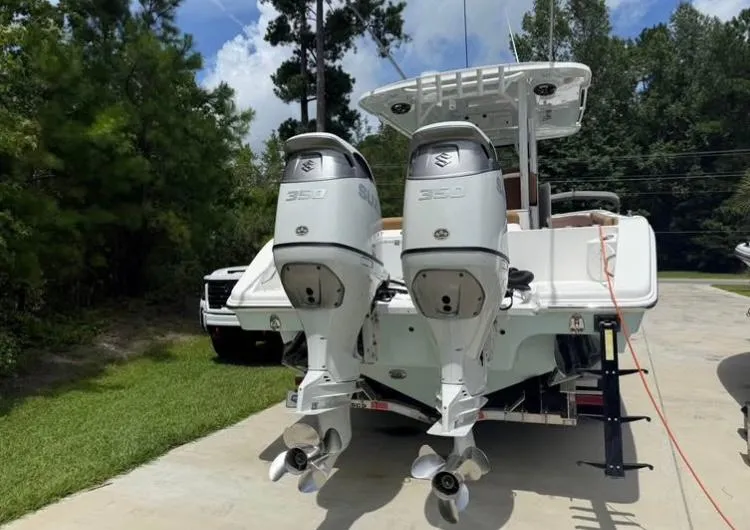 Slide: The Image of 2022 Sea Pro 320 DLX Offshore boat with dual Suzuki 350 outboard engines. - 3