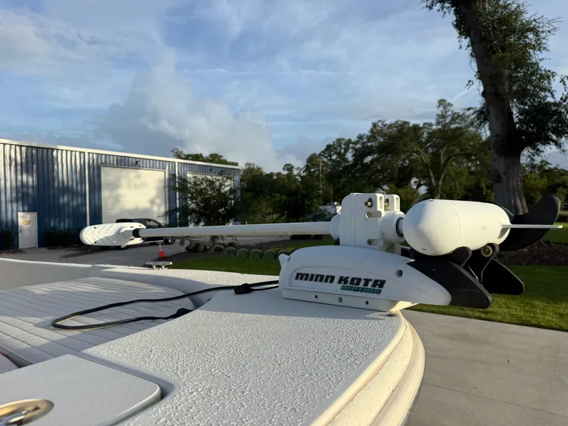 Slide: The Image of Minn Kota trolling motor on 2016 Carolina Skiff 238DLV boat, outdoors. - 8