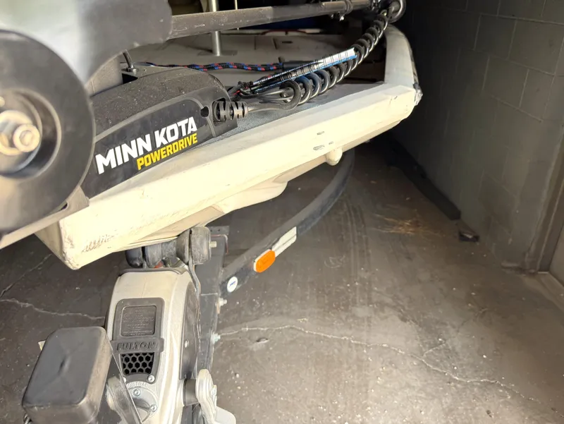 Slide: The Image of Minn Kota PowerDrive motor on a 2004 Lowe 170W boat in a garage. - 14