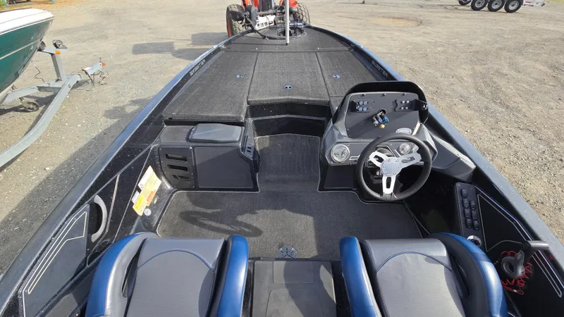 Slide: The Image of 2017 Skeeter ZX 250 boat interior with steering wheel and seating. - 13