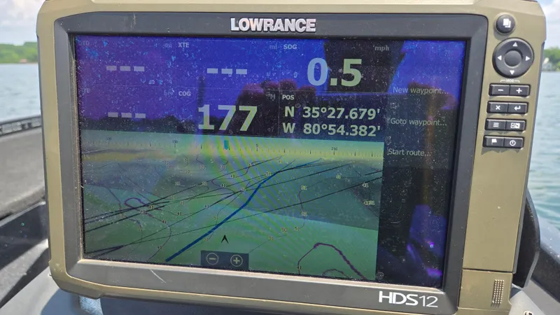 Slide: The Image of Lowrance HDS12 GPS display on 2017 Skeeter ZX 250 boat, showing coordinates and navigation data. - 18