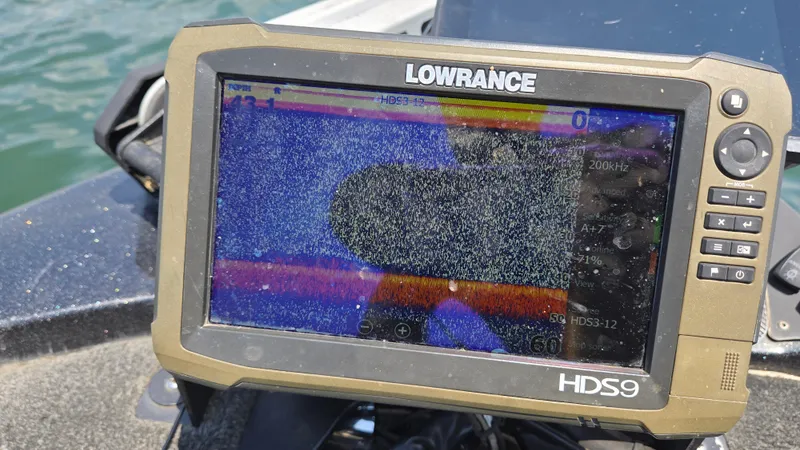 Slide: The Image of Lowrance HDS9 fishfinder on 2017 Skeeter ZX 250 boat, displaying sonar data. - 20