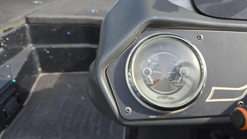 Slide: The Image of Dashboard of a 2017 Skeeter ZX 250 boat showing fuel and volt gauges. - 26