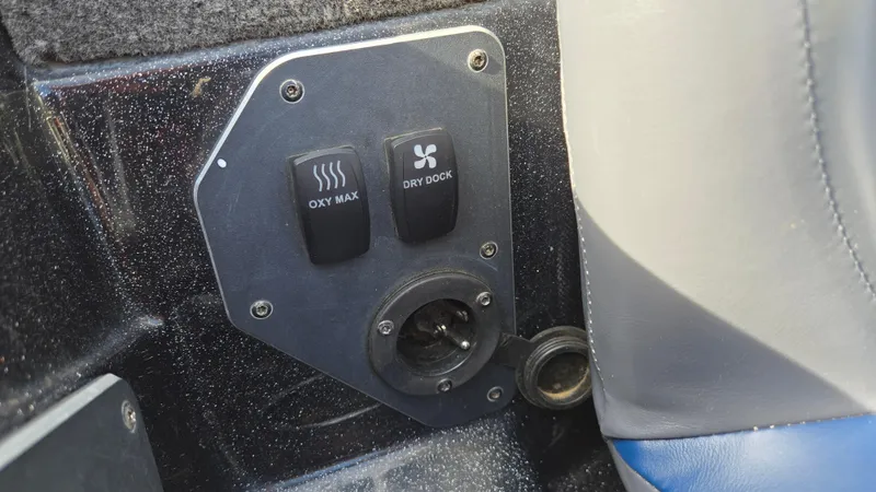 Slide: The Image of Control panel on a 2017 Skeeter ZX 250 boat with Oxy Max and Dry Dock switches. - 27