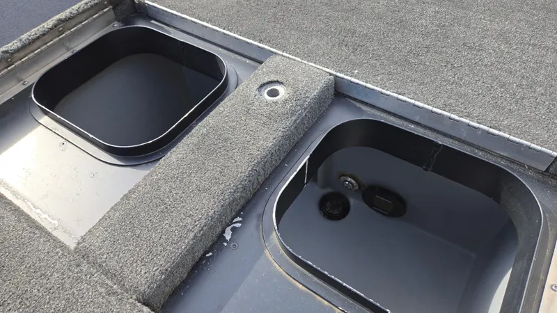 Slide: The Image of 2017 Skeeter ZX 250 boat storage compartments with carpeted surfaces. - 32