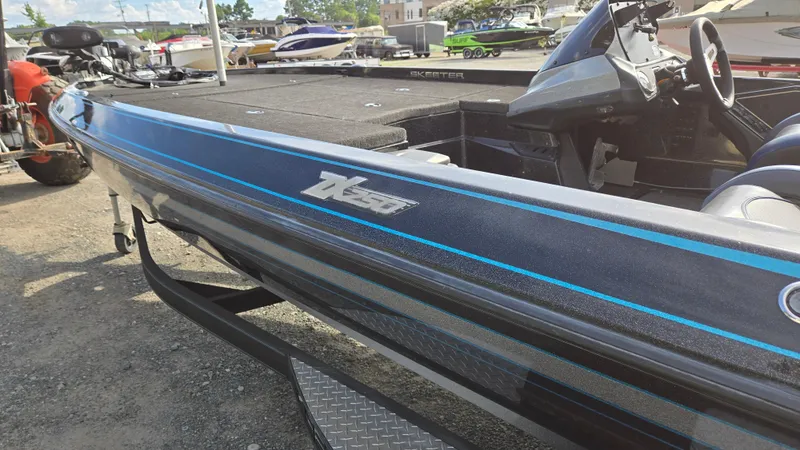 Slide: The Image of 2017 Skeeter ZX 250 boat with sleek design, parked outdoors. - 4