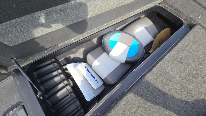 Slide: The Image of Storage compartment in a 2017 Skeeter ZX 250 boat with equipment and accessories. - 44