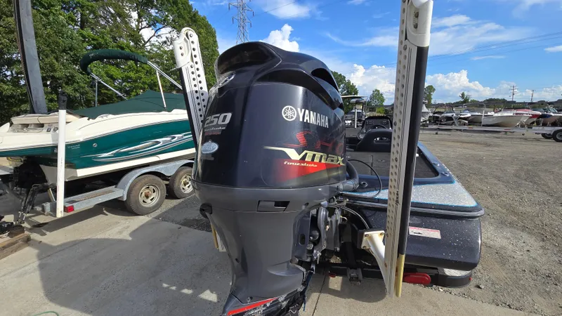 Slide: The Image of 2017 Skeeter ZX 250 boat with Yamaha VMAX outboard motor, parked outdoors. - 6