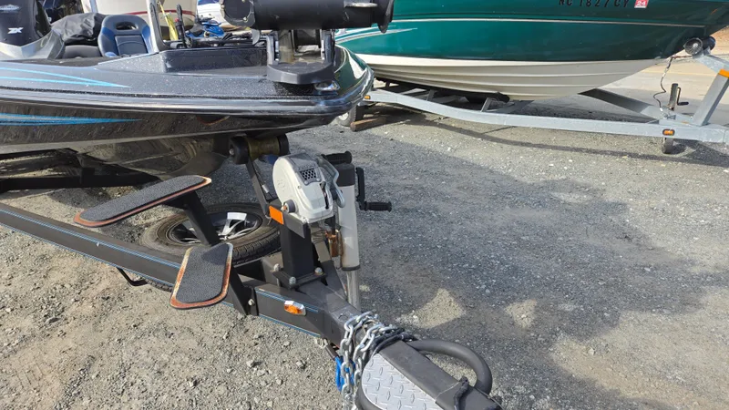 Slide: The Image of 2017 Skeeter ZX 250 boat on trailer, parked on gravel surface. - 8