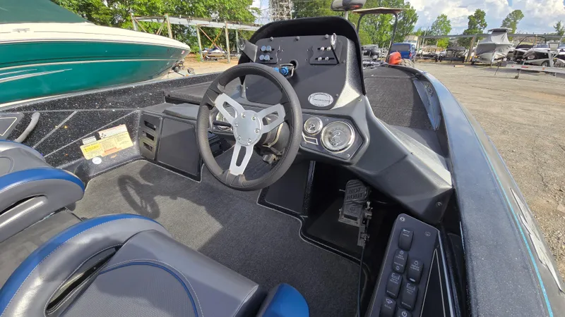 Slide: The Image of 2017 Skeeter ZX 250 boat cockpit with steering wheel and control panel. - 9