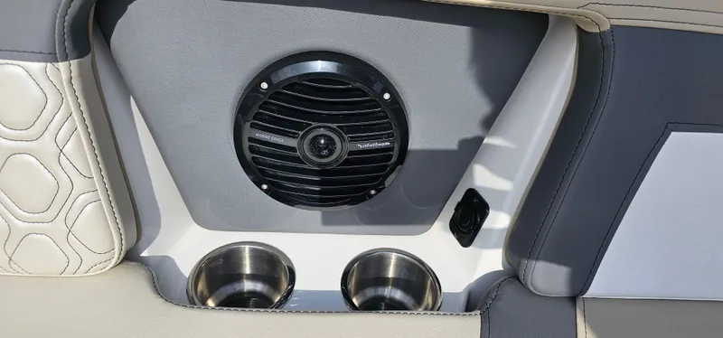 Slide: The Image of 2025 Heyday H22 boat interior with speaker and dual cup holders. - 10