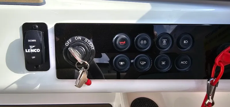 Slide: The Image of Control panel of a 2025 Heyday H22 boat with ignition and switches. - 15