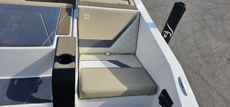Slide: The Image of 2025 Heyday H22 boat interior with beige and gray seating, cup holder, and stylish design. - 20