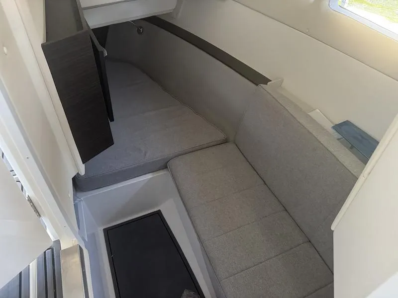 Slide: The Image of Interior cabin of 2026 Cobalt R35 boat with gray seating and modern design. - 13