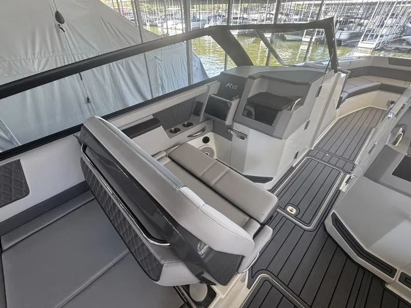 Slide: The Image of Interior of 2026 Cobalt R35 boat with sleek seating and modern dashboard design. - 8