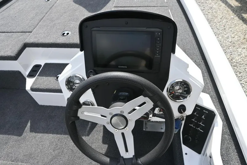 Slide: The Image of 2021 Vexus AVX2080 boat dashboard with steering wheel and Garmin display. - 11