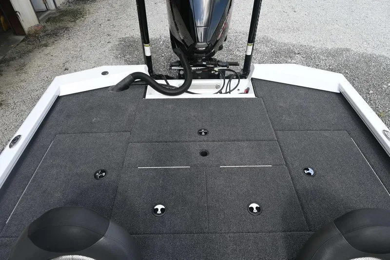 Slide: The Image of 2021 Vexus AVX2080 boat deck with carpeted surface and motor. - 4