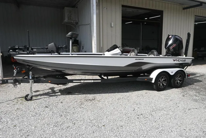 Slide: The Image of 2021 Vexus AVX2080 boat on trailer, parked outside a building. - 5