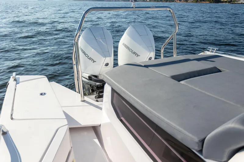 Slide: The Image of 2021 Axopar 37XC Aft Cabin boat with dual Mercury outboard engines on water. - 18