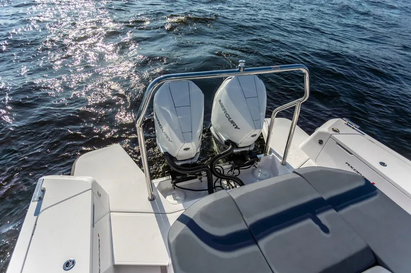 Slide: The Image of 2021 Axopar 37XC Aft Cabin with twin Mercury outboard engines on water. - 19