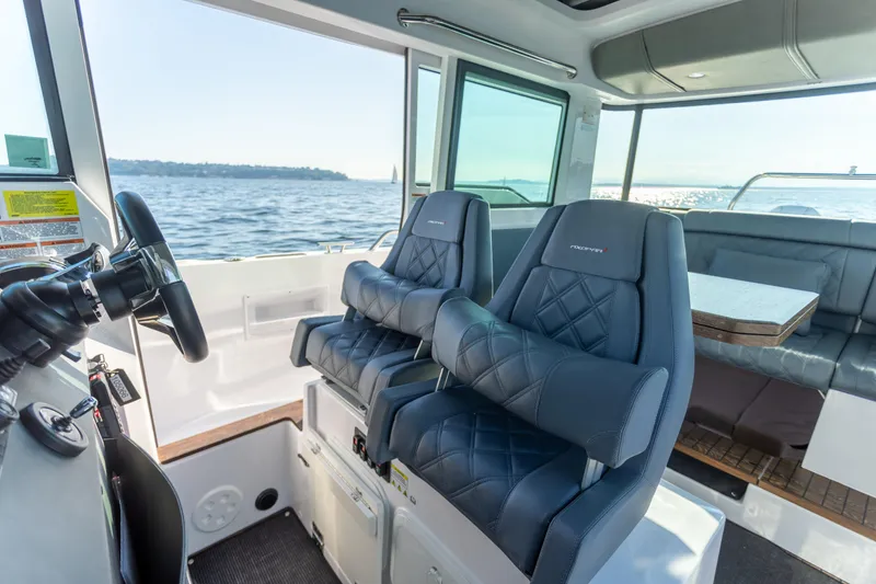 Slide: The Image of Interior of 2021 Axopar 37XC Aft Cabin with luxurious seating and ocean view. - 22