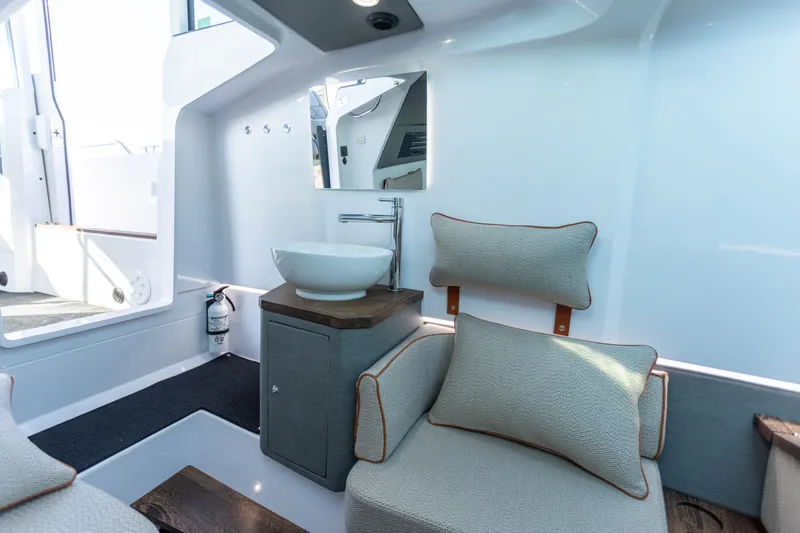 Slide: The Image of Interior of 2021 Axopar 37XC Aft Cabin with modern sink and seating. - 33