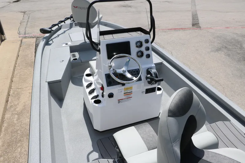 Slide: The Image of 2025 Vexus ACX 2000 boat interior with steering console and seating. - 12