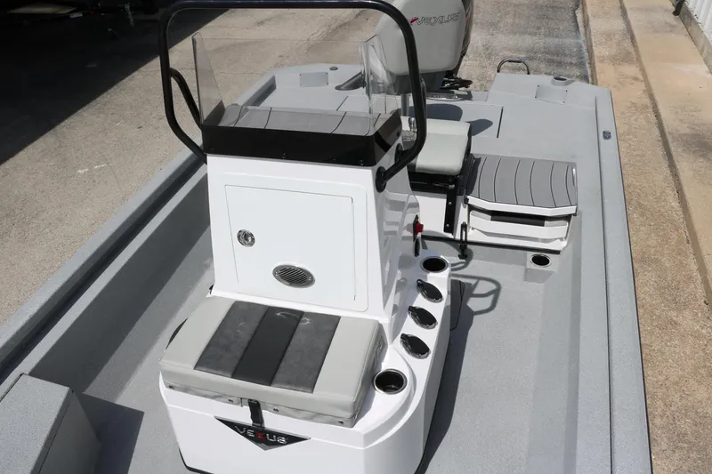 Slide: The Image of 2025 Vexus ACX 2000 boat interior with seating and console, showcasing modern design. - 18