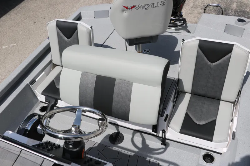 Slide: The Image of 2025 Vexus ACX 2000 boat interior with modern seating and steering wheel. - 22