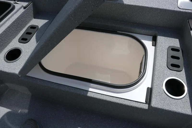 Slide: The Image of 2025 Vexus ACX 2000 boat storage compartment with cup holders and sleek design. - 25