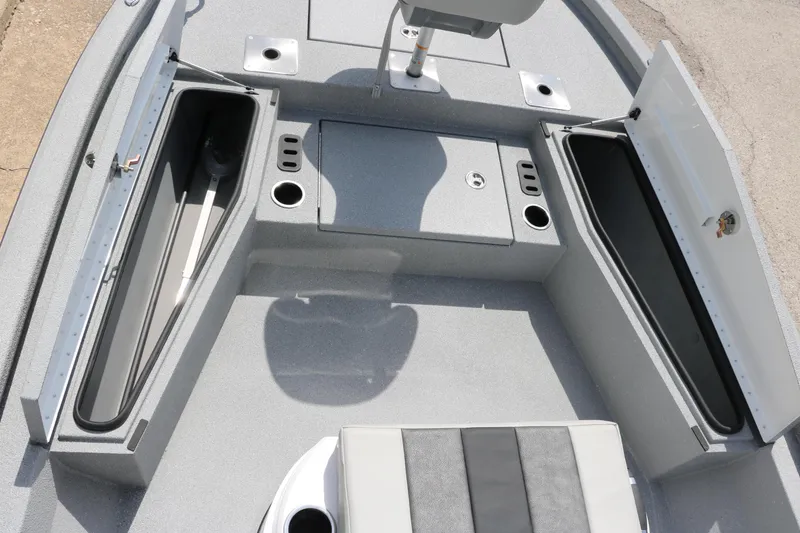 Slide: The Image of 2025 Vexus ACX 2000 boat interior with open storage compartments and seating. - 26