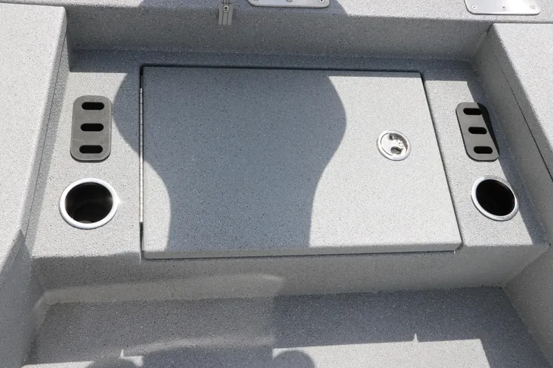 Slide: The Image of 2025 Vexus ACX 2000 boat deck with storage compartment and cup holders. - 27