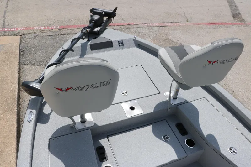 Slide: The Image of 2025 Vexus ACX 2000 boat interior with seating and trolling motor. - 28