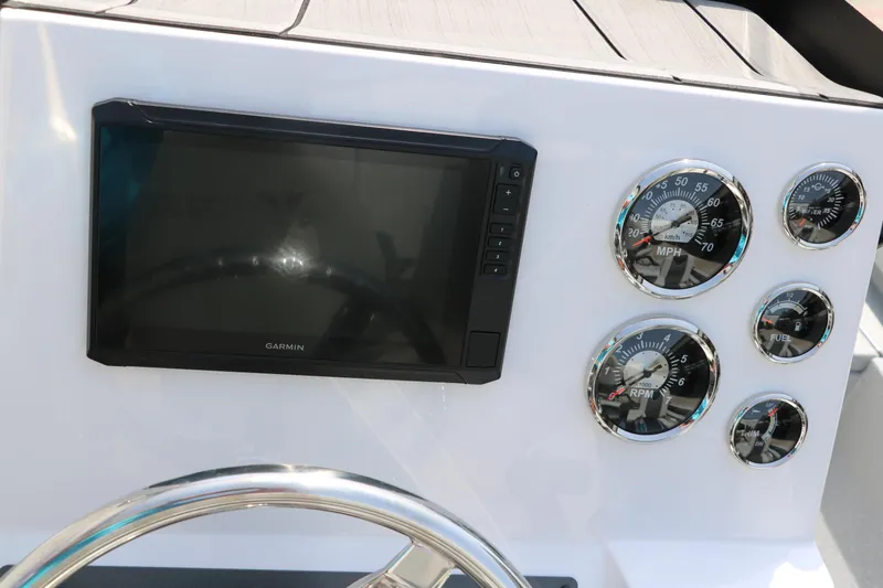 Slide: The Image of Dashboard of 2025 Vexus ACX 2000 boat with Garmin display and gauges. - 31