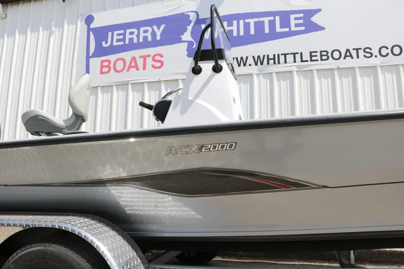 Slide: The Image of 2025 Vexus ACX 2000 boat displayed at Jerry Whittle Boats dealership. - 8