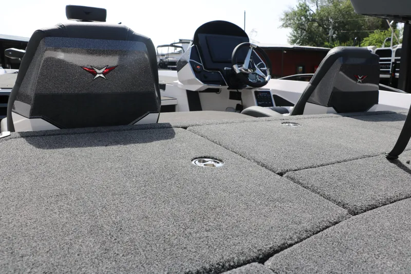 Slide: The Image of 2025 Vexus VXS 21 boat interior with plush seating and modern dashboard. - 10