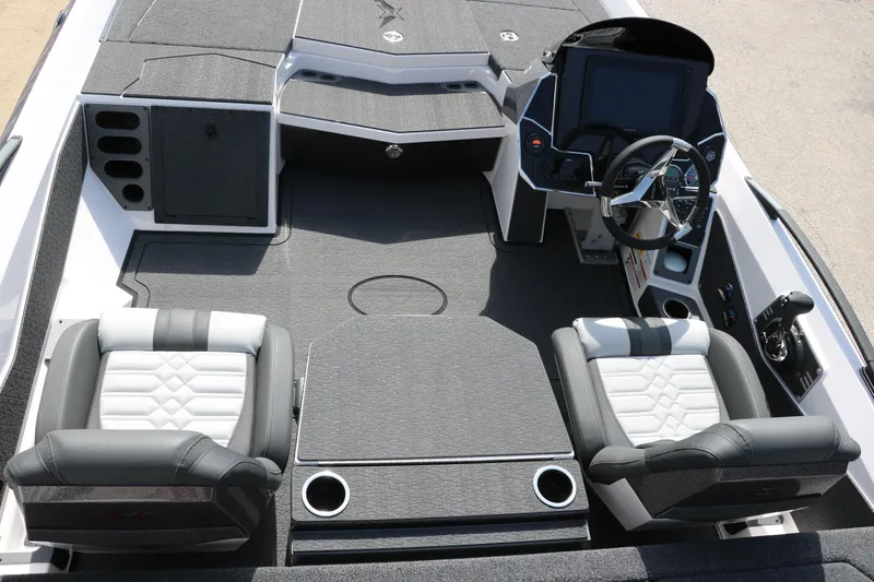 Slide: The Image of 2025 Vexus VXS 21 boat interior with modern seating and advanced dashboard controls. - 13