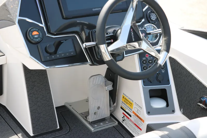 Slide: The Image of 2025 Vexus VXS 21 boat dashboard with steering wheel and control panel. - 15