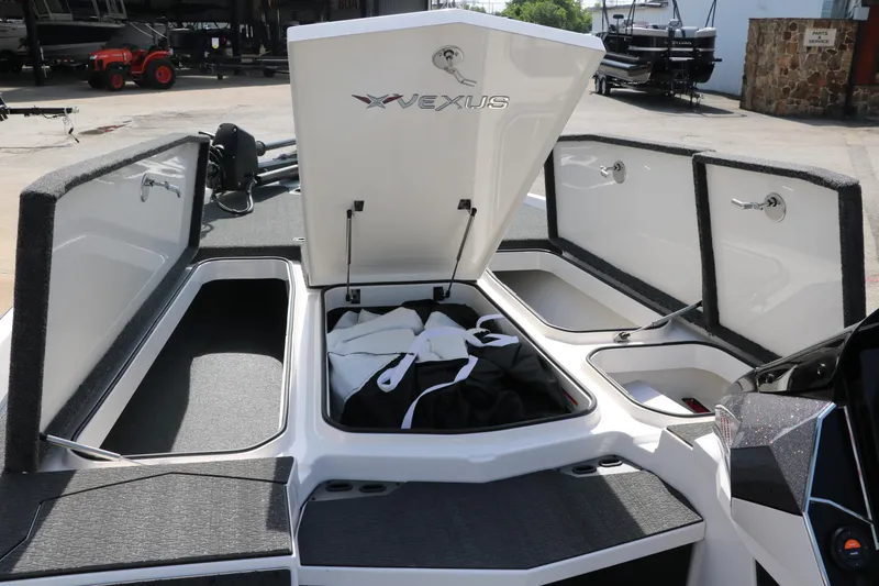 Slide: The Image of 2025 Vexus VXS 21 boat storage compartments open, showcasing spacious interior design. - 24