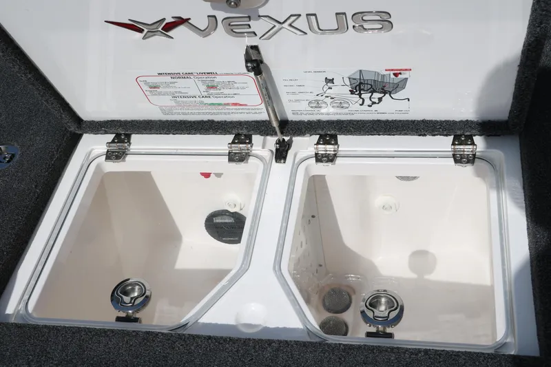 Slide: The Image of Vexus VXS 21 2025 livewell compartments with detailed instructions and branding. - 28