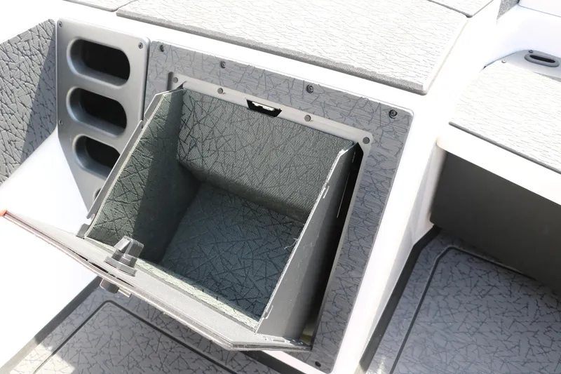 Slide: The Image of Open storage compartment in 2025 Vexus VXS 21 boat, featuring textured interior design. - 31