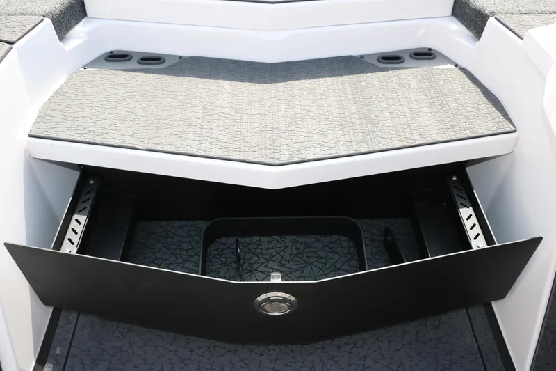 Slide: The Image of 2025 Vexus VXS 21 boat storage compartment with open drawer, showcasing interior design. - 32