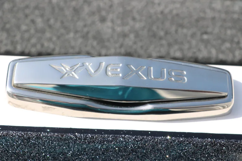 Slide: The Image of Chrome Vexus logo on 2025 VXS 21 boat, close-up view. - 35